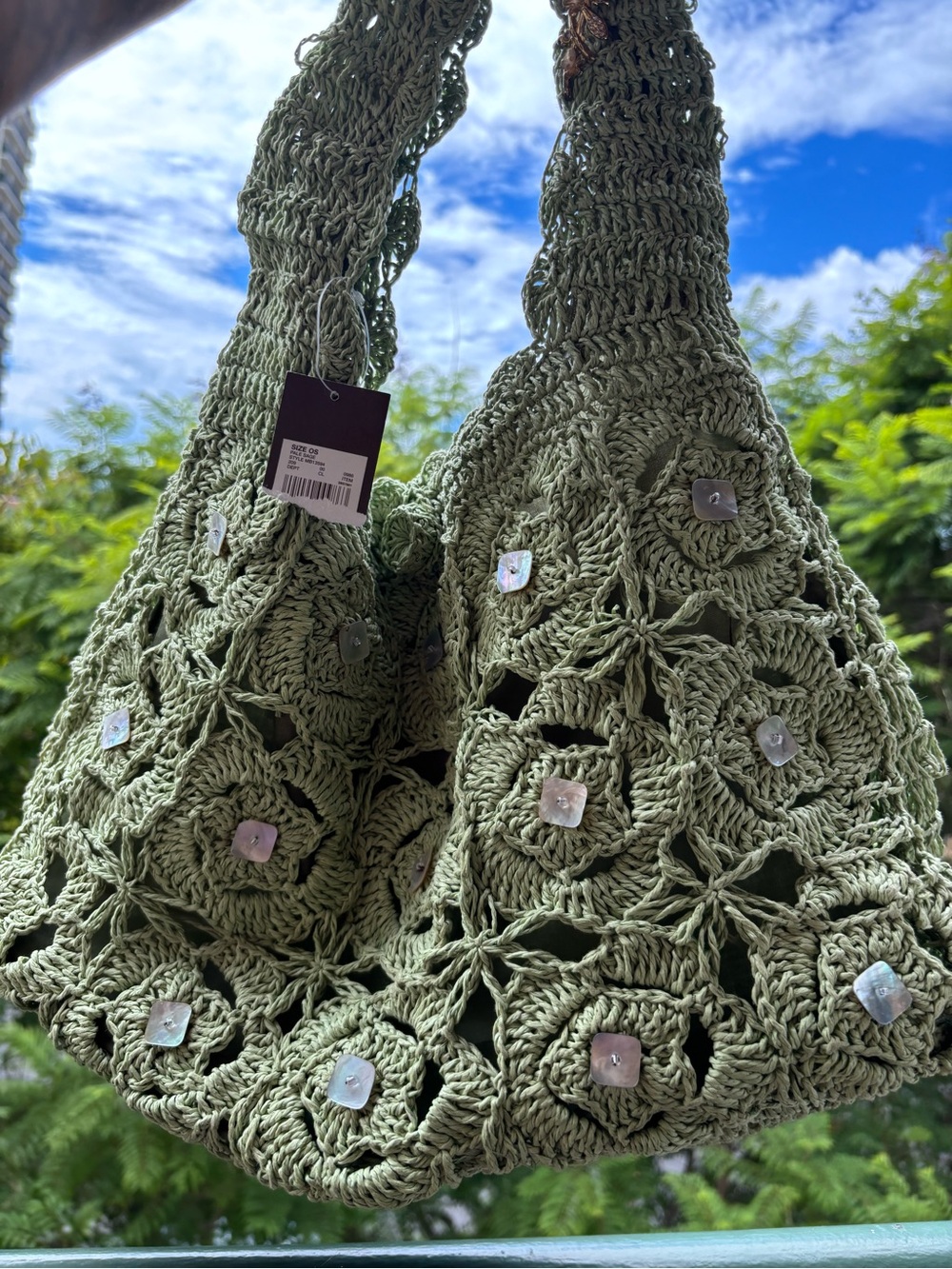 Green crochet bag with shell embellishments brand new with the tags